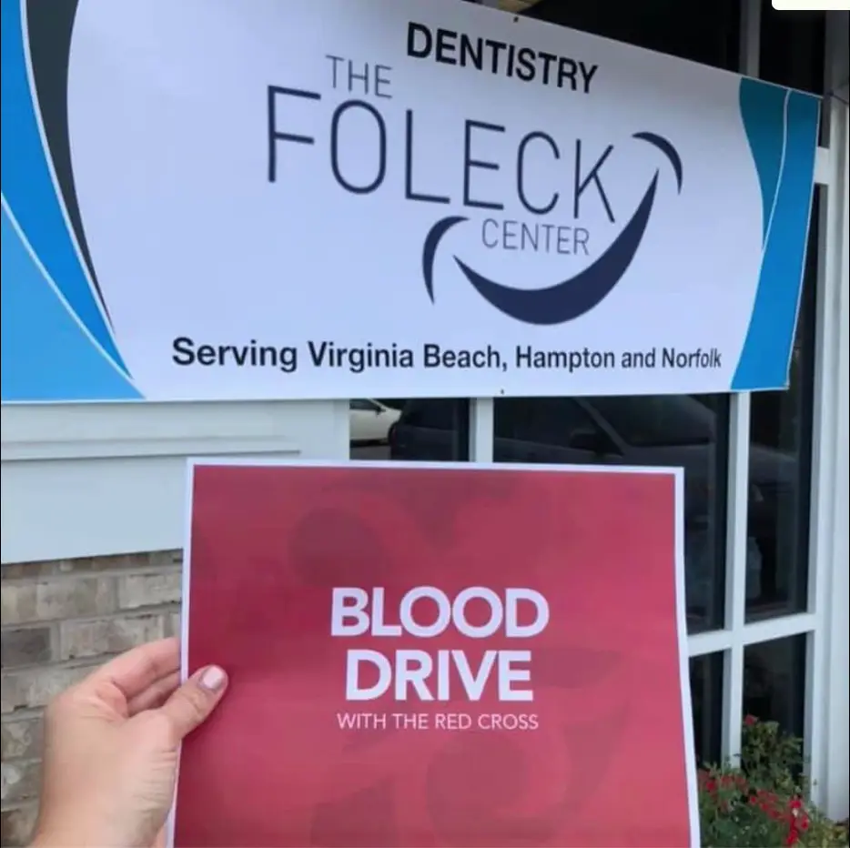 a red flyer with "Blood Drive" in front of The Foleck Center in Virginia Beach