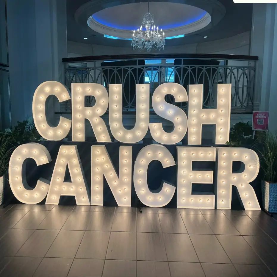 A marquee sign that says Crush Cancer