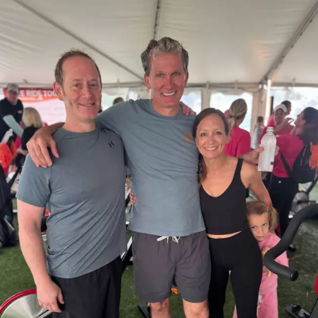 Adam Foleck with other cycling marathoners at a fundraiser