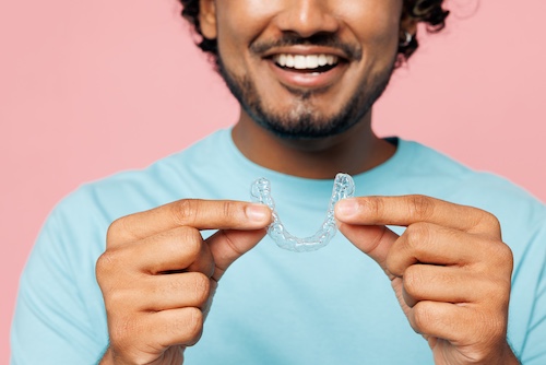 Man Holding Invisalign