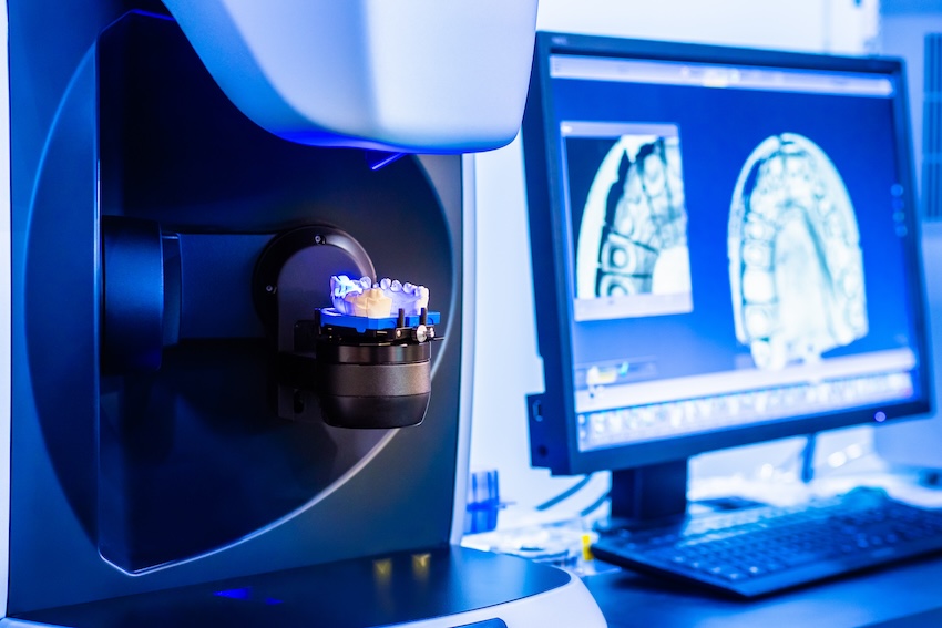 Dental implant specialist using 3D CT scan technology and computer guided planning for precise implant placement in Virginia Beach