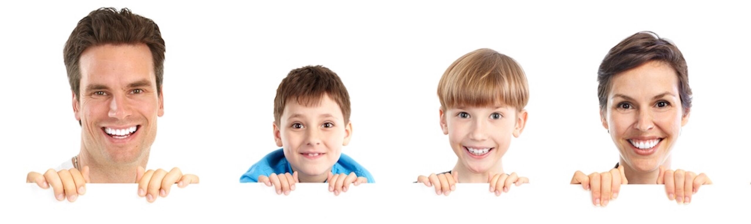 The faces of a father, mother, and two young sons are smiling in front of a white background.