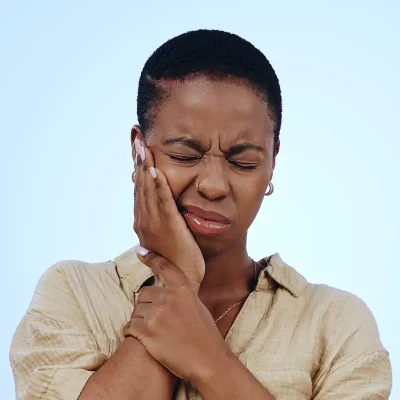 Woman with tooth ache in a dental emergency